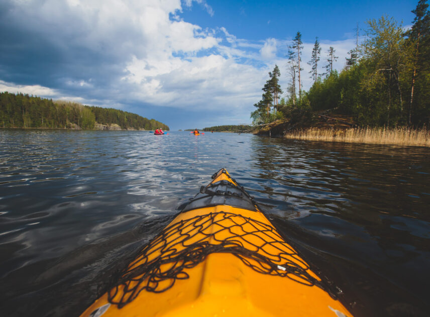 A process of kayaking in the lake skerries, with colorful canoe kayak boat paddling, process of canoeing, vibrant summer picture